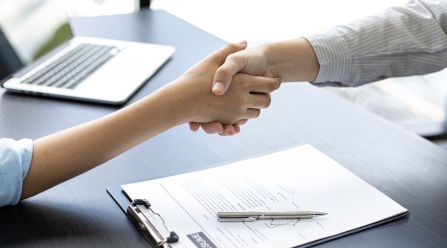 grounded theory vs phenomenology researcher and interviewee shake hands